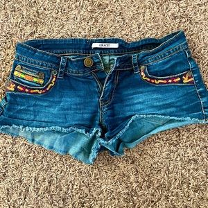 Grace in LA booty shorts with fun colorful pockets